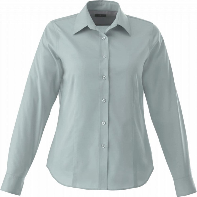 A women's button-up shirt in a soft green colour, featuring long sleeves and a classic collar. It has a logo on it.