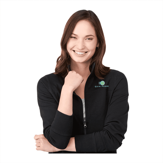 A woman wearing a black polar fleece full zip jacket, featuring a logo on the shoulder.