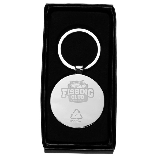 A circular keyring made from recycled zinc alloy with a sleek silver finish, presented in a black box.