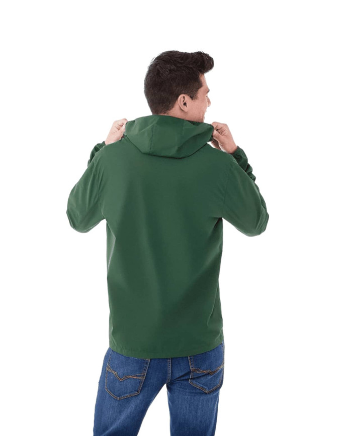 A man wearing a green packable rain jacket with a hood, viewed from the back. The jacket has a logo on it.