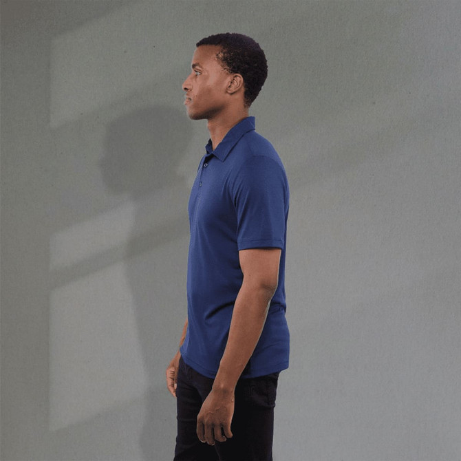 A blue men's polo shirt displayed on a model, featuring a subtle logo on the chest.