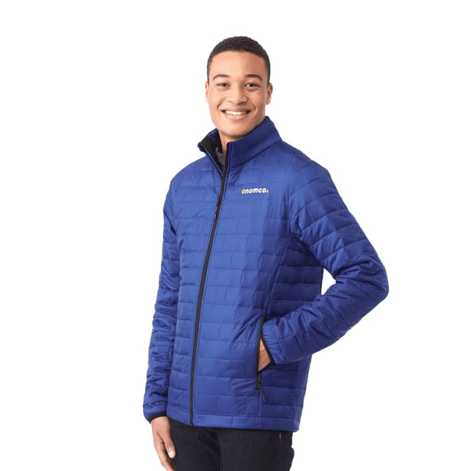 A man wearing a blue lightweight packable insulated puffer jacket with a logo on the chest.