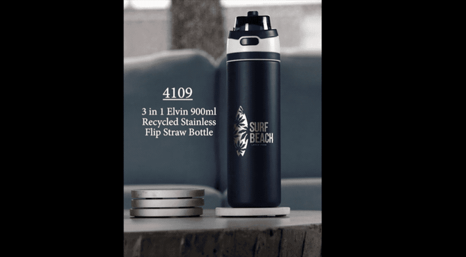 A drink bottle in dark blue with a flip straw lid, featuring a silver logo and standing on a white base.