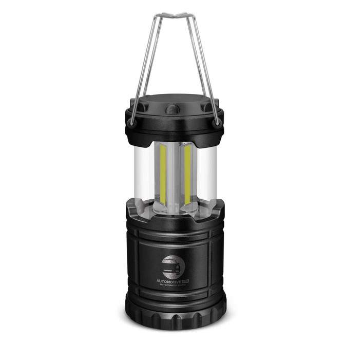 A compact black lantern with a clear casing and a handle, featuring two internal yellow lights.