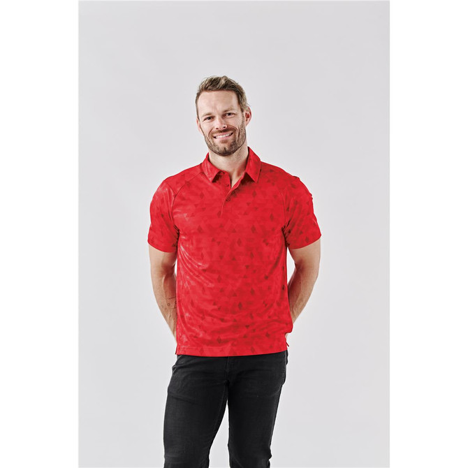 A man wearing a red polo shirt with a subtle pattern, featuring a logo on the chest and a classic collar.