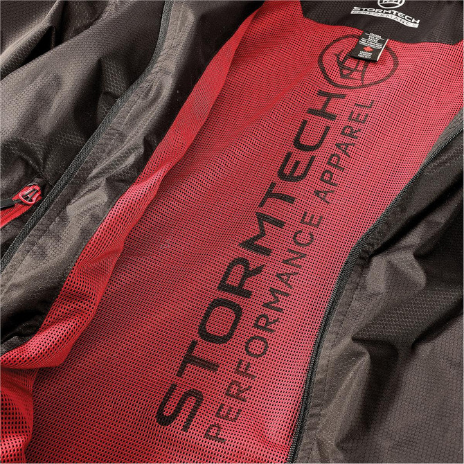 A black jacket with a red lining and mesh interior, featuring a logo and text.
