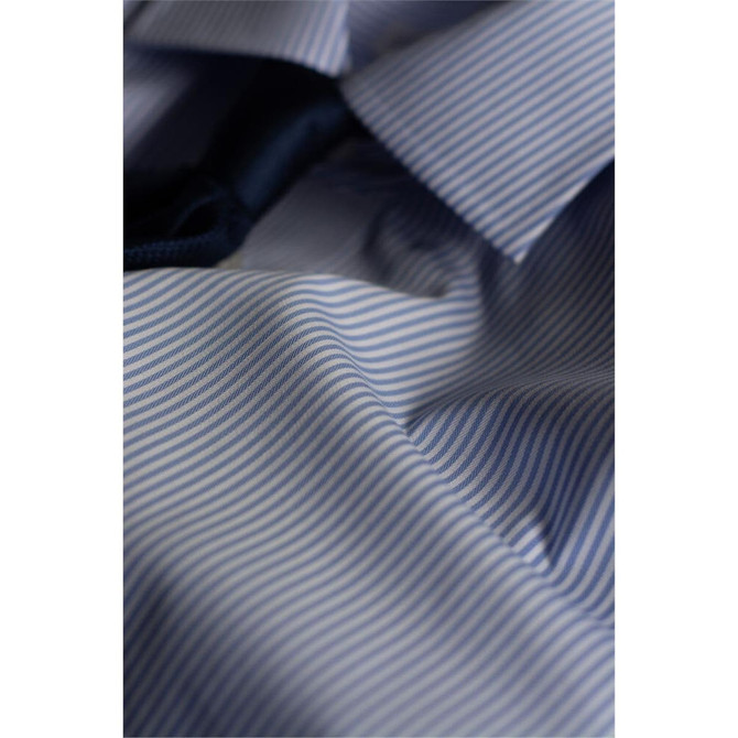 A close-up of a blue and white striped button-up shirt, featuring a collar and part of a black tie.