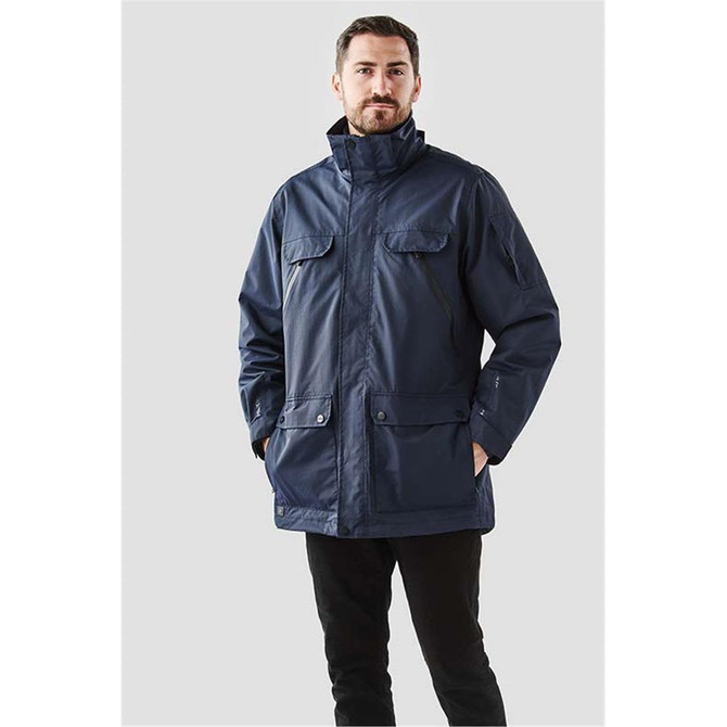 A navy blue men's jacket featuring two front pockets and a high collar, with a logo on the sleeve.