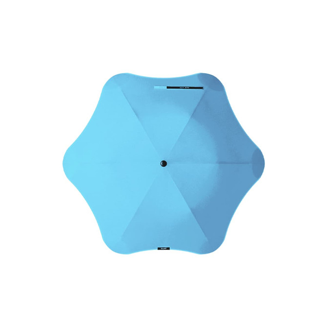 A blue BLUNT Metro Umbrella with a unique star shape and a central button mechanism. It features branding on the canopy.