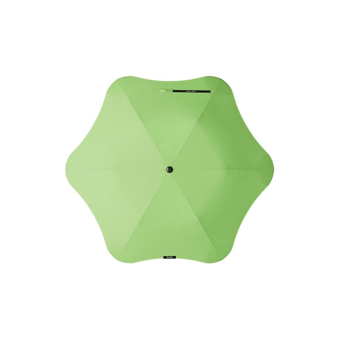 A green BLUNT Metro Umbrella with an octagonal shape and a central button, featuring a logo.