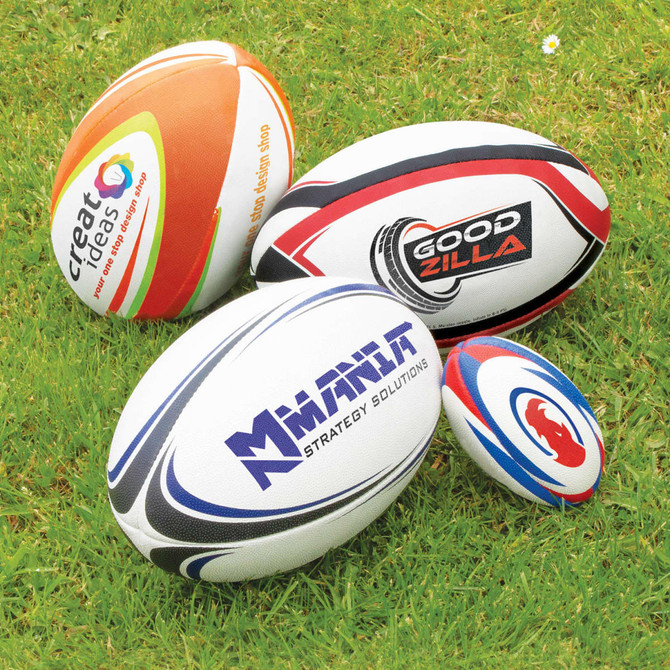 A collection of four rugby balls in various sizes and designs, featuring logos and branding.
