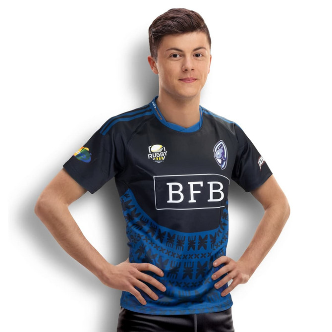 A young man wearing a custom men's rugby performance T-shirt in navy blue with a logo.
