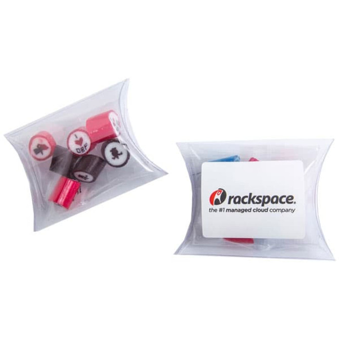 A transparent pillow pack containing assorted rock candy in pink, red, and blue, with a branding label included.