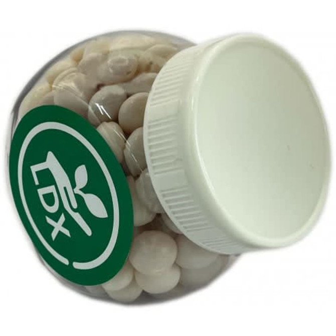 A clear plastic jar filled with white mints, featuring a white lid and a green logo.