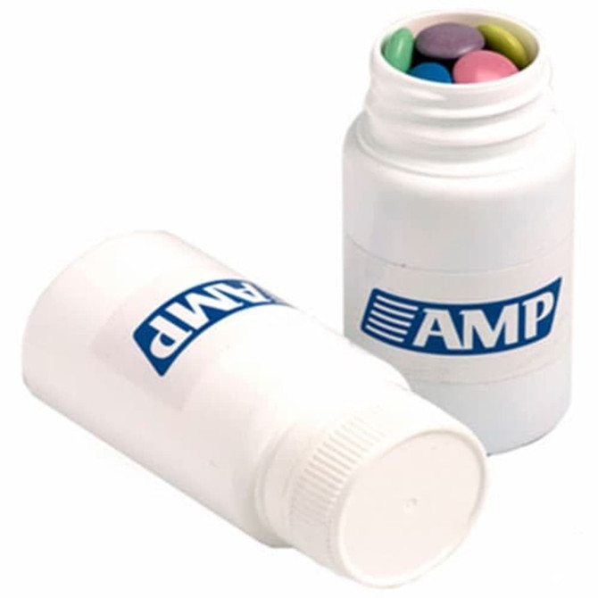 A white pill jar containing colourful chocolate beans, with a logo on the jar.