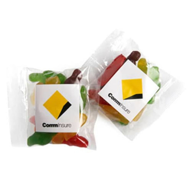 A packet of Jelly Babies featuring assorted colours, including green, red, yellow, and orange, with a logo on the packaging.