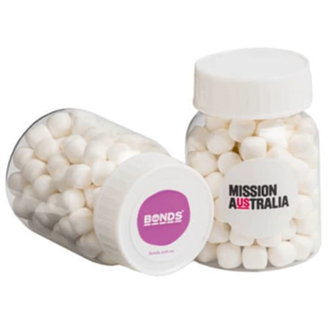 A clear jar containing white mints, featuring a logo on one side. The jar is transparent with a sealed lid.