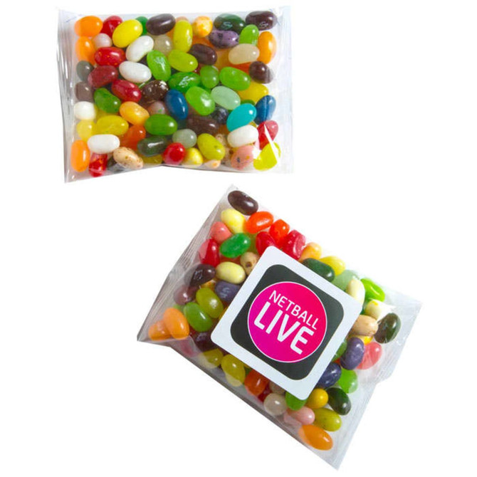 A transparent bag filled with colourful jelly beans in various shades, including green, yellow, red, and purple.