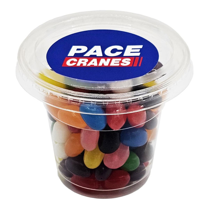 A clear tub filled with colourful mini jelly beans in various shades. The tub has a logo on the lid.