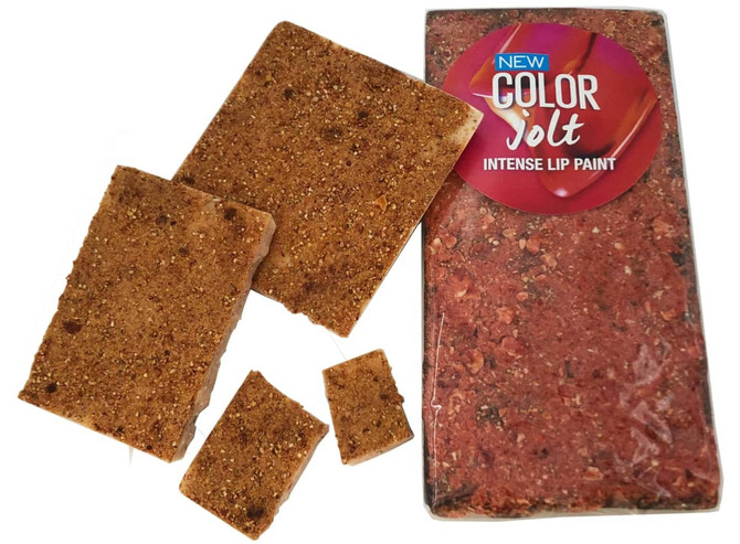 A transparent pack containing several pieces of freeze-dried strawberries in a rich red colour.
