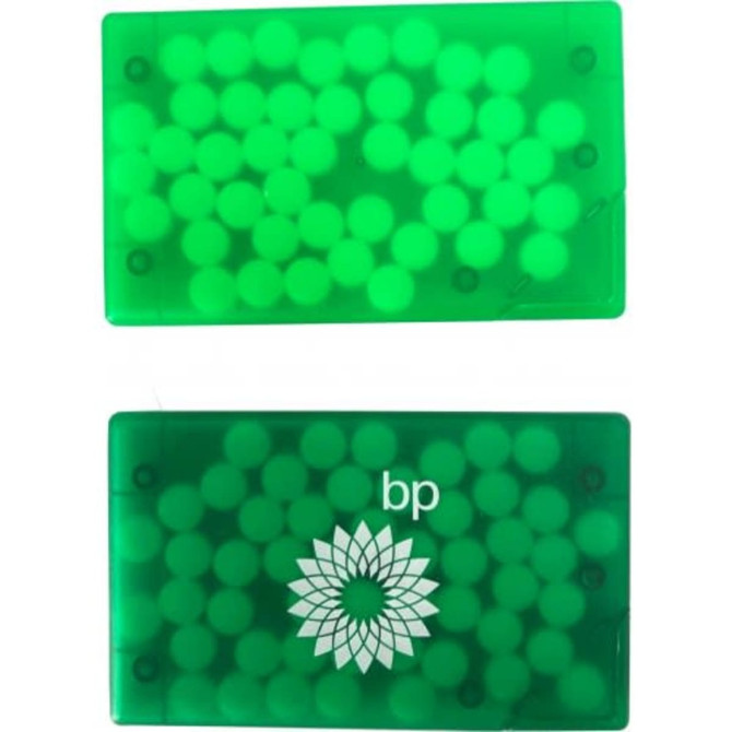 A green credit card-sized mint card filled with small round mint candies, featuring a logo.