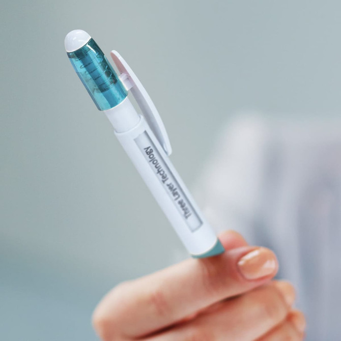 A white and teal plastic pen with a transparent top, featuring a logo and a clip for easy attachment.
