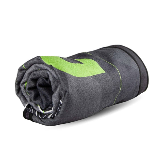 A rolled-up beach towel in grey with green accents, featuring a subtle patterned design and a logo.