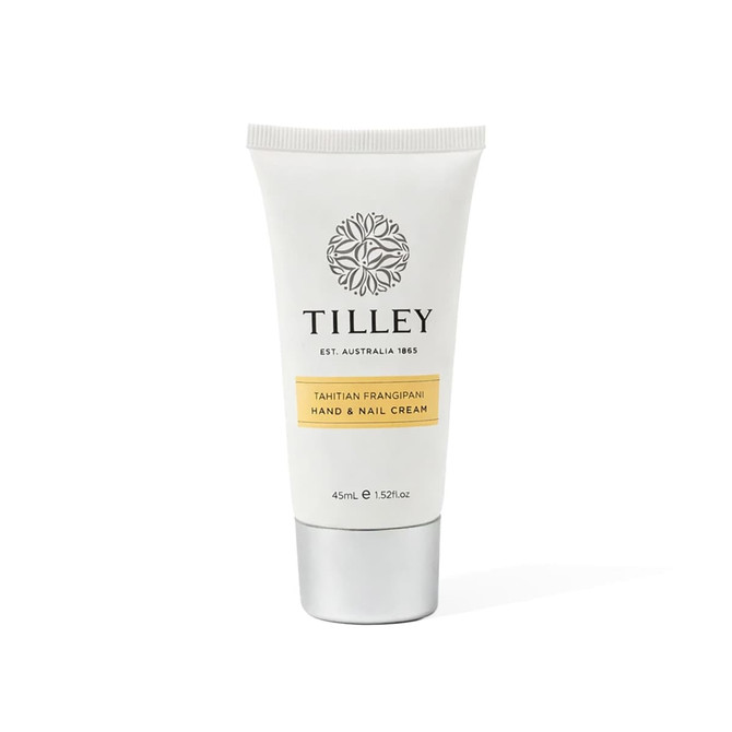 A hand and nail cream tube in white and silver, featuring a floral logo and a yellow label.