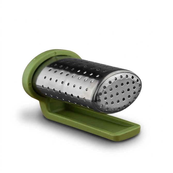 A travel tea infuser in silver metal with a green plastic base, designed for steeping loose tea.