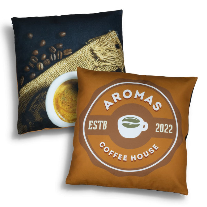 A decorative cushion featuring a coffee design on one side and a coffee cup with beans on the other, in brown and cream colours.