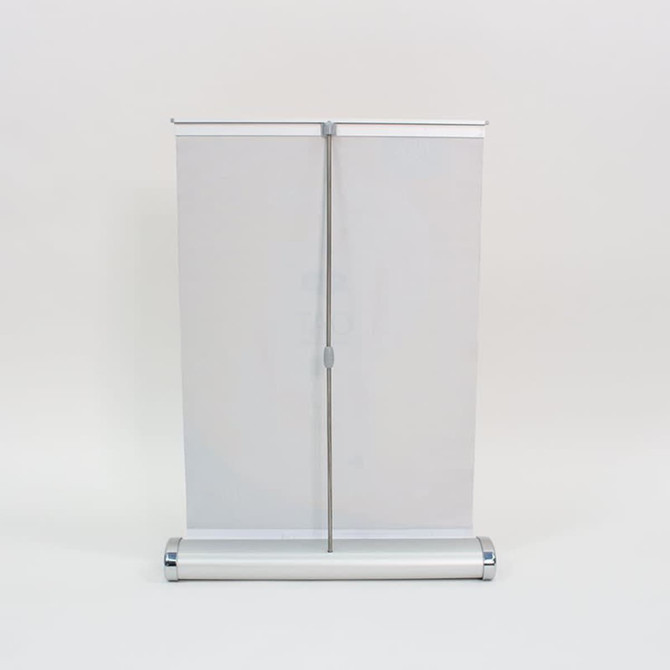 A3 counter top pull-up banner with a silver base and a white retractable display surface. Features a logo.