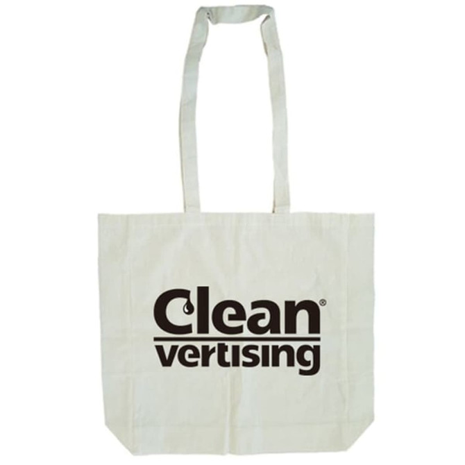 A calico tote bag in a light beige colour with long handles and a gusset, featuring a logo.