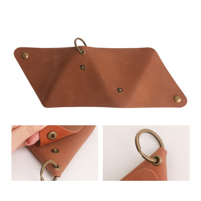 A triangular, tan leather coin holder with brass snaps and a ring for attachment. It has a smooth finish.