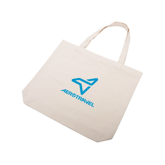 A cream cotton tote bag with blue branding, featuring sturdy handles and a spacious design.