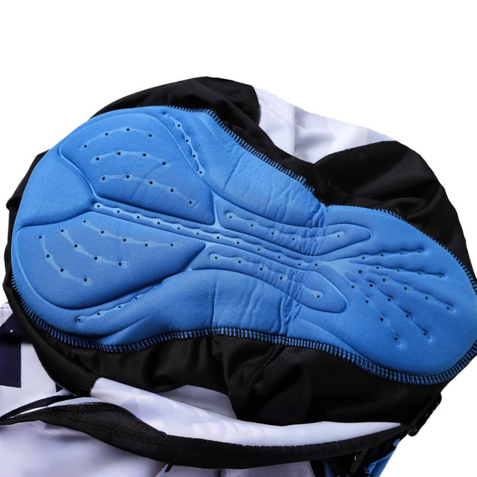 Close-up of blue padded interior of men's sublimated cycling bib tights with black outer fabric and a logo.