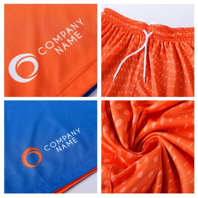 Reversible basketball shorts featuring orange and blue designs, with a logo displayed on each side and a drawstring.