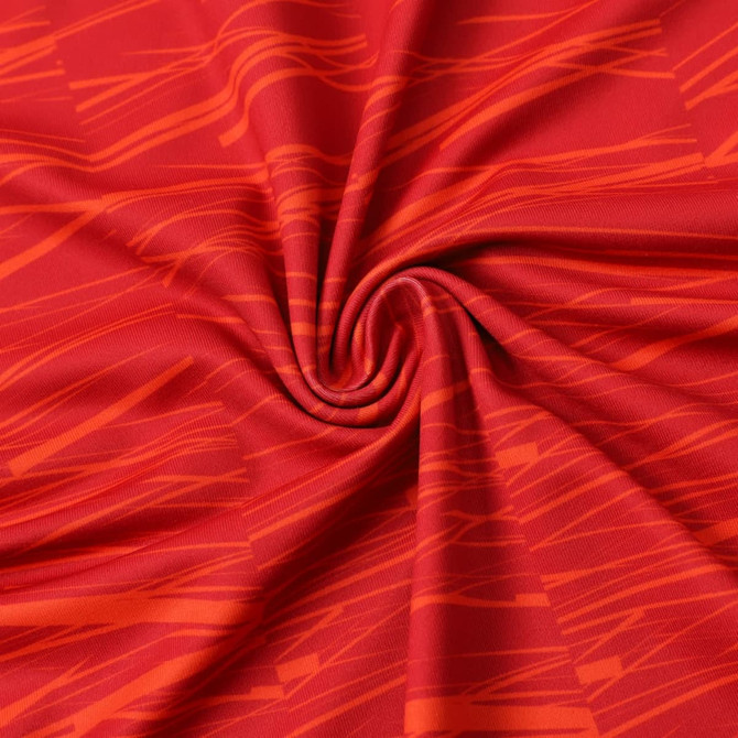 A red fabric featuring a dynamic pattern of lighter red lines, suitable for sports apparel.