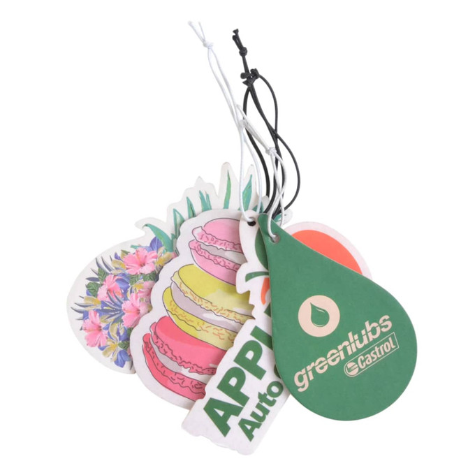 A set of colourful custom car air fresheners, featuring floral and macaron designs, with a green-shaped tag.