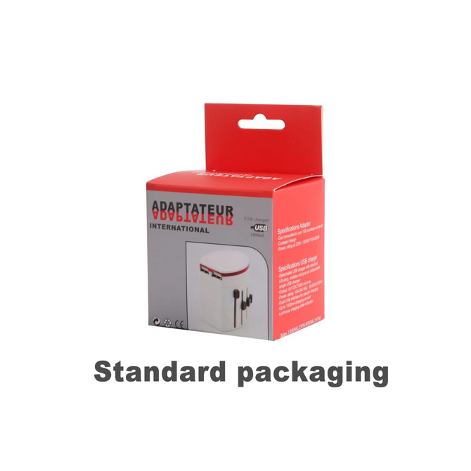 A travel adapter with USB ports in a white and red box, featuring a logo on the packaging.