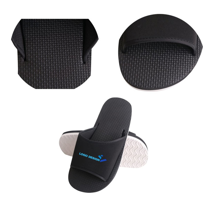 Black EVA slides featuring a textured sole and a logo design on the strap. Suitable for casual wear.