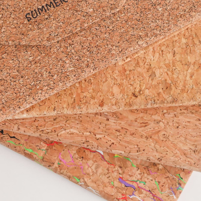 Foldable cork glasses case in natural cork with a textured finish, featuring colourful abstract patterns on one side.