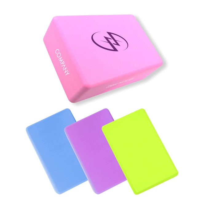 A pink EVA yoga block with a logo, accompanied by blue, purple, and neon green blocks.