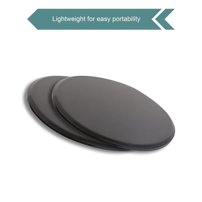 Two black yoga sliding disks are shown side by side, designed for easy portability. Each disk features a smooth surface.