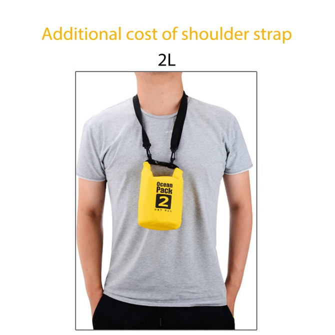 A yellow waterproof dry bag with a shoulder strap, worn by a person, featuring a logo on the front.