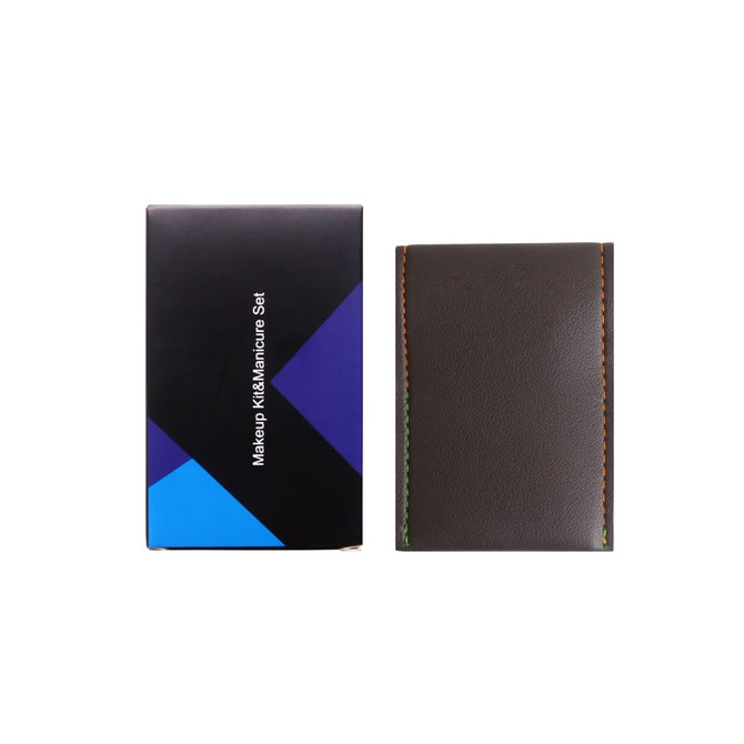 A portable manicure set in a sleek, dark brown case, packaged in a stylish black and blue box.