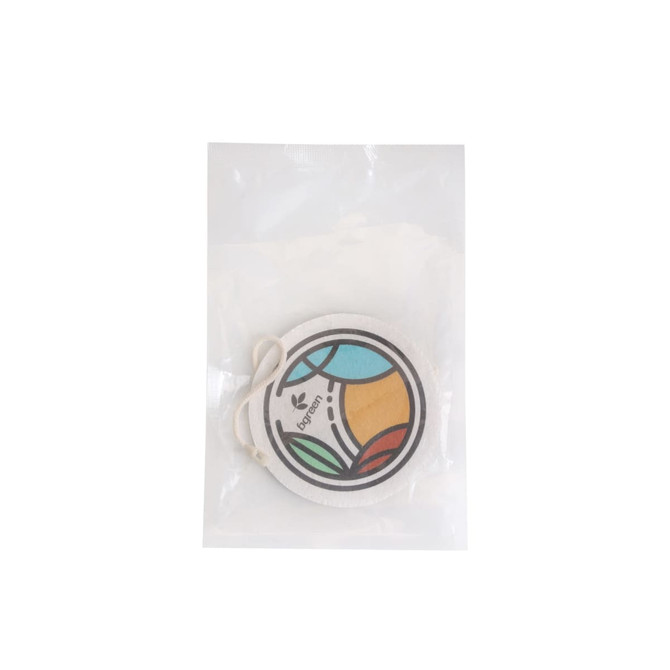 An expandable dishwashing sponge in a clear package, featuring a colourful circular design with green, blue, and orange elements.