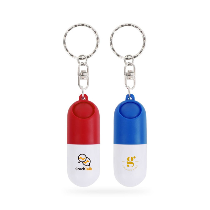 A red and white pill capsule keychain alongside a blue and white pill capsule keychain, both with logos.