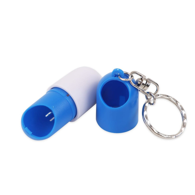 A blue and white pill capsule keychain with a silver keyring attachment. It features a cylindrical design with open ends.