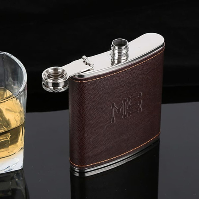 A drink bottle in a classic design, featuring a brown textured exterior and a silver stainless steel top.