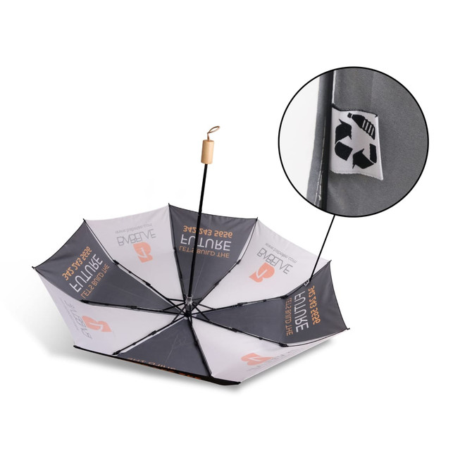 A triple folding RPET umbrella in black and grey, featuring a logo and a recycling symbol on one panel.